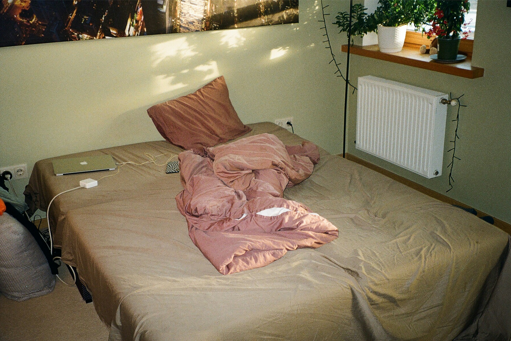 Messy bedroom with unmade bed before virtual staging